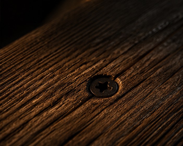Close detail of deck board grain with a structural screw