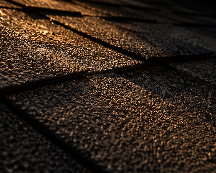 Close detail of overlapping asphalt roof shingles