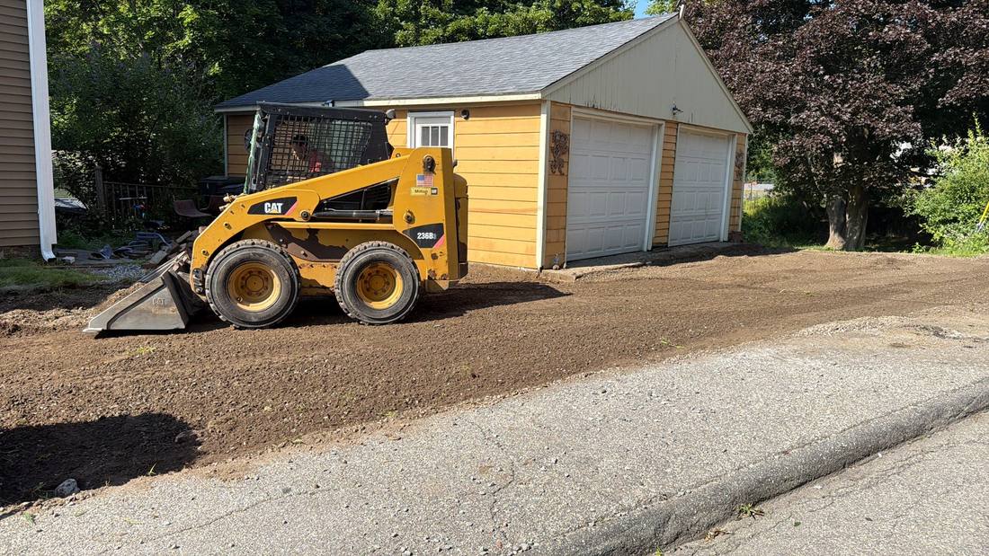 The old gravel surface being torn out to full depth