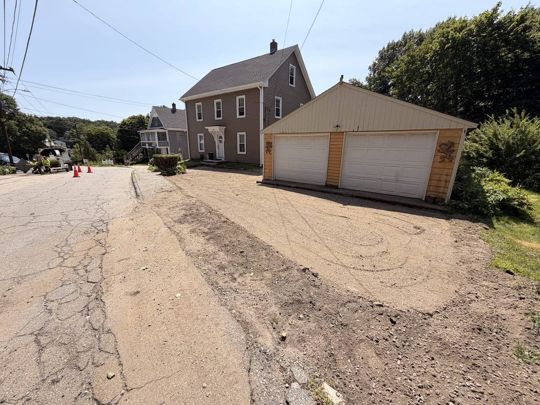 The compacted base screeded flat and pitched before any paver is laid