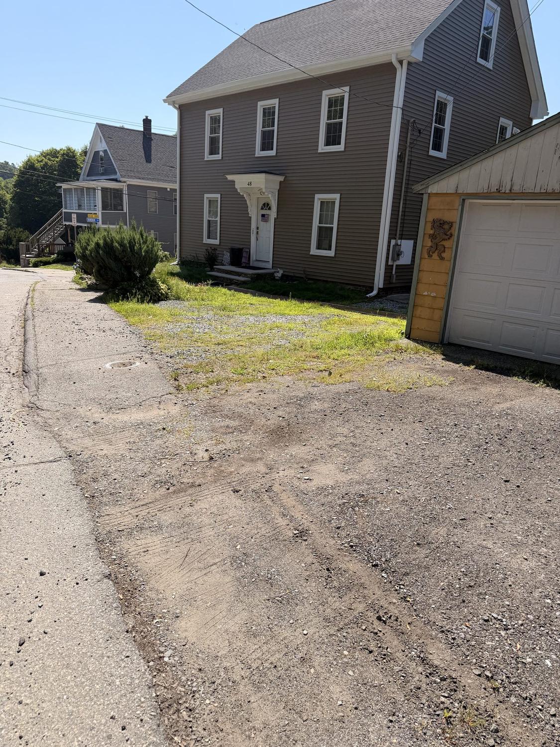 Before — loose gravel stopping short of the front steps