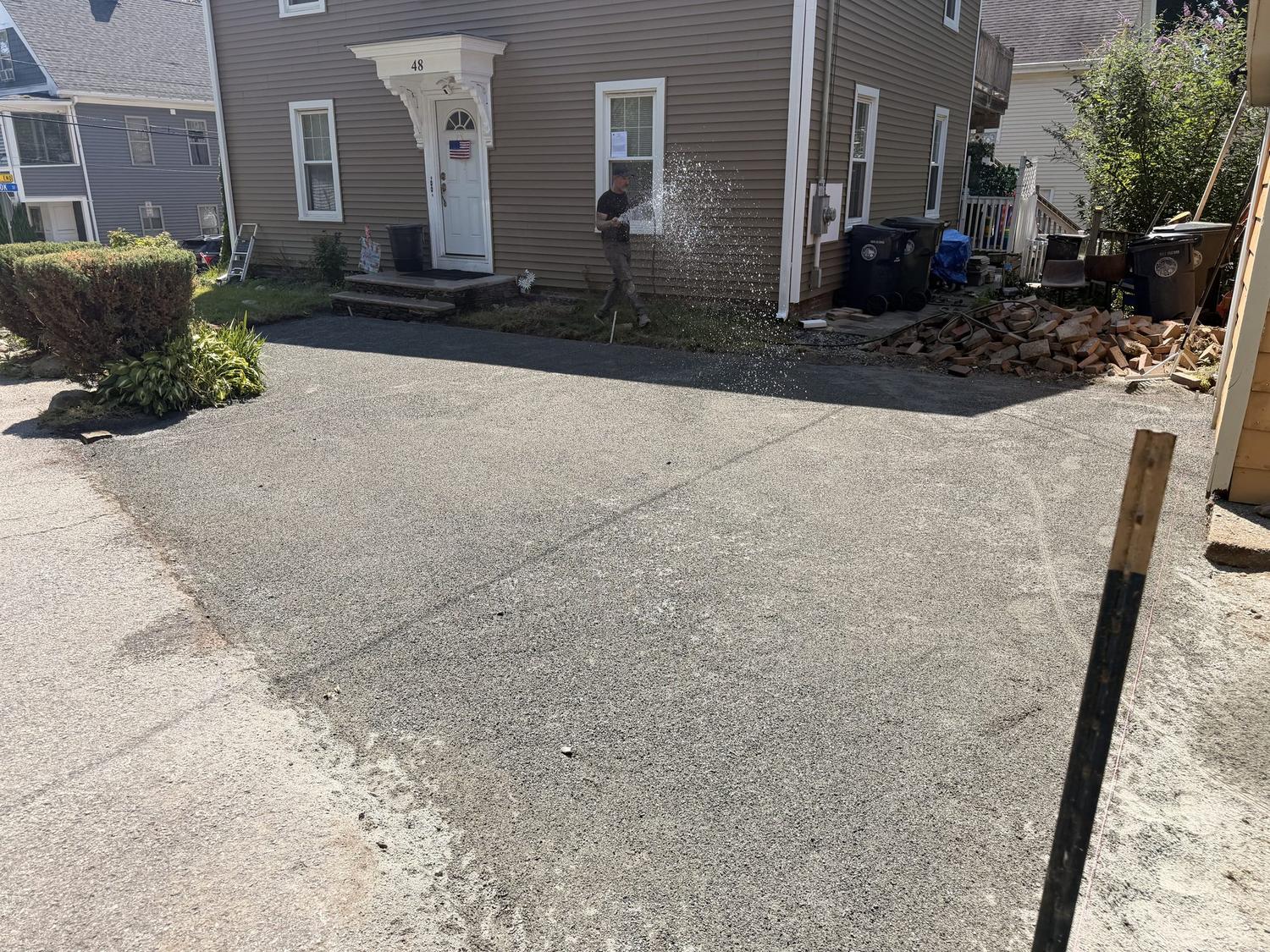 After — a clean, level paver run through the side entry between the houses