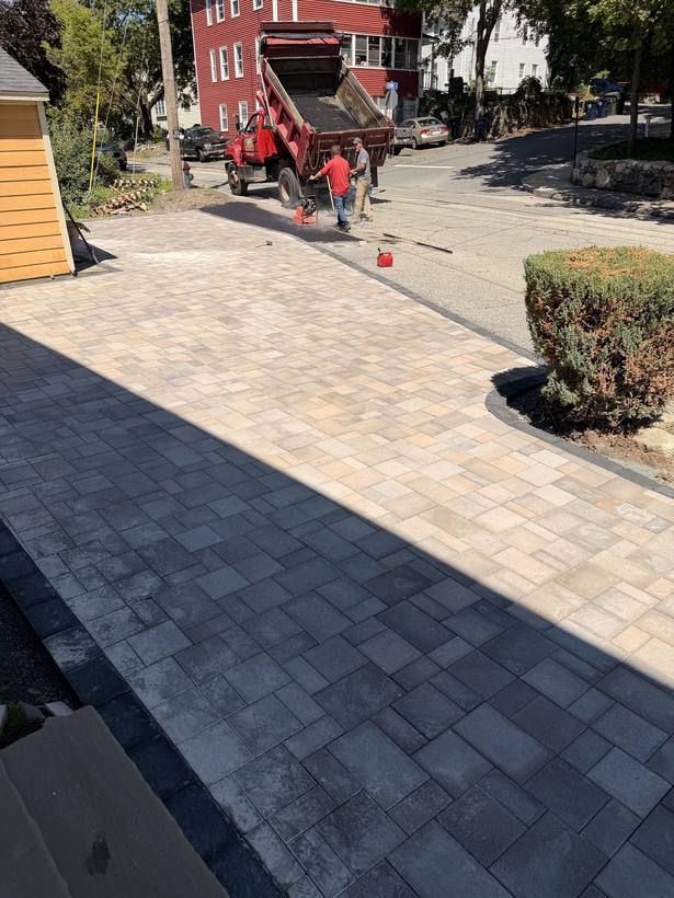 Paver cuts fitted around the curve of the walk