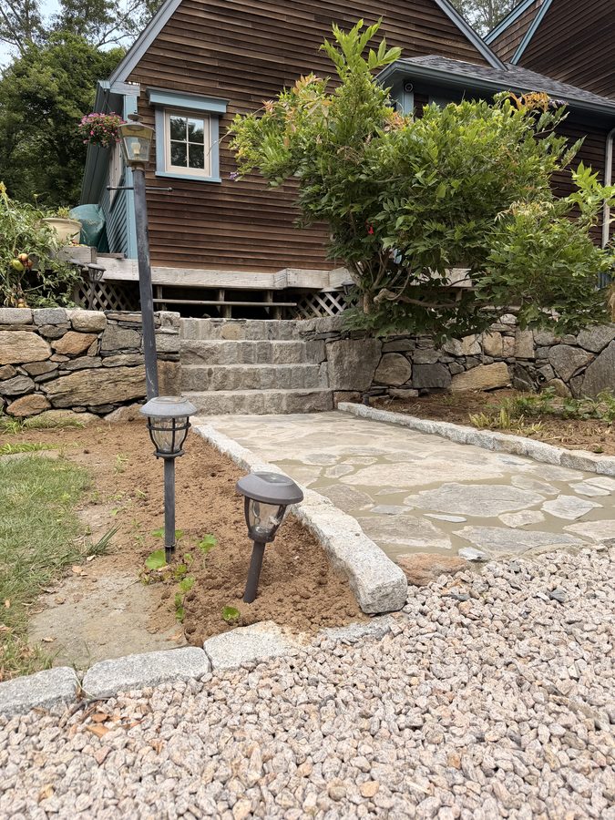 Granite cobble edging where the walk meets the driveway