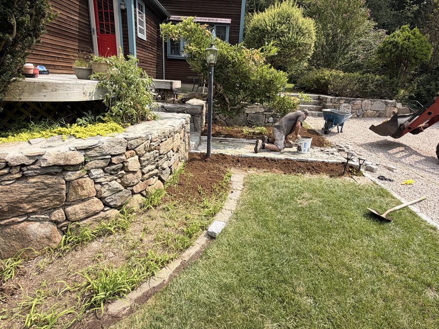 The whole work area — walls, walk and beds — seen from the lawn