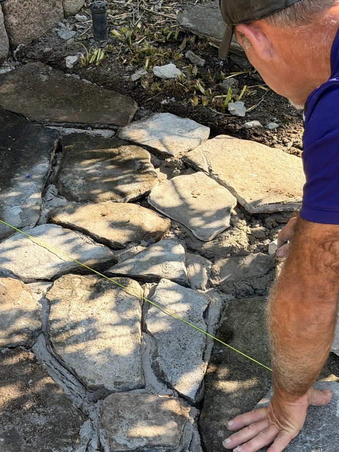 Close on the flagstone joints, cut tight and packed