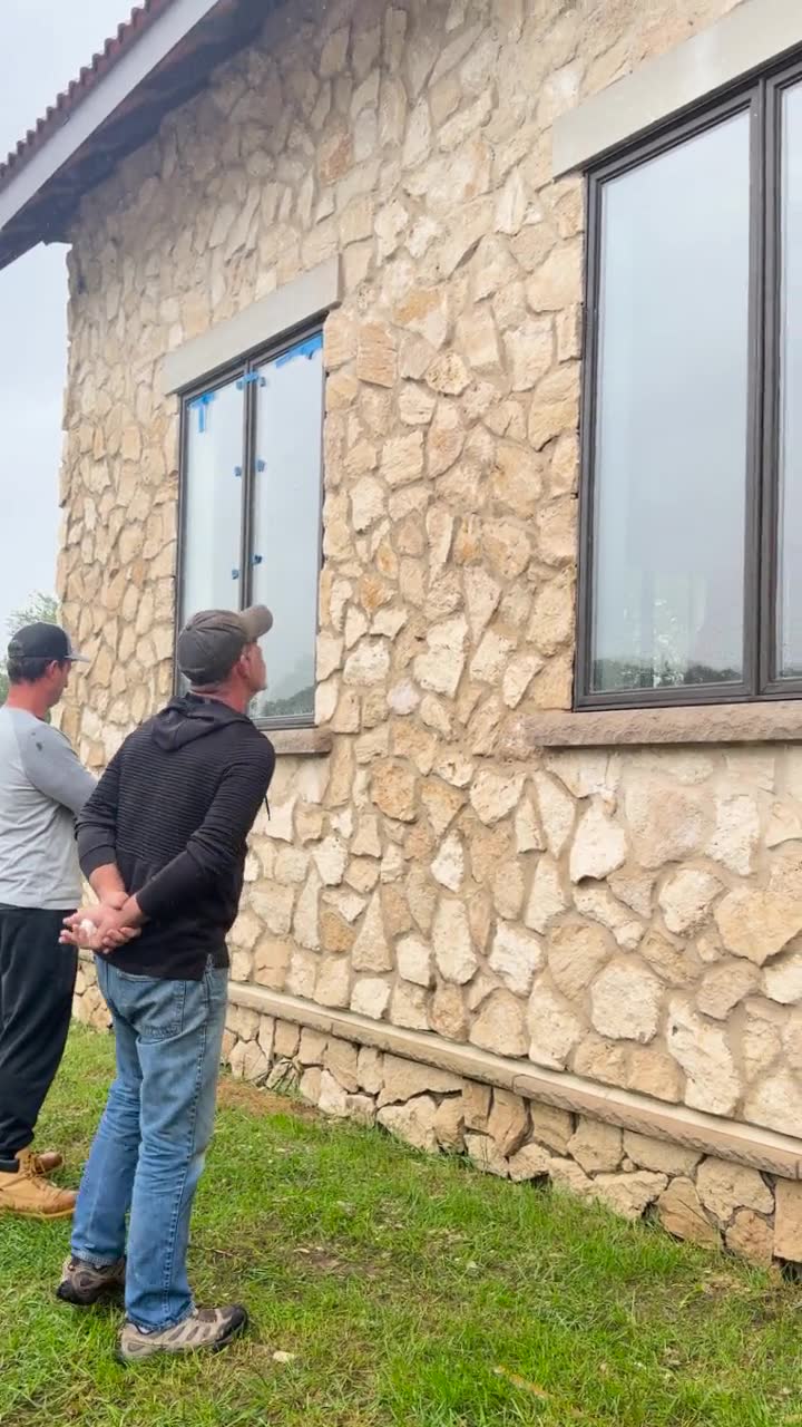 Walking the stone wall of the house at the start of the job in Cream Ridge, New Jersey