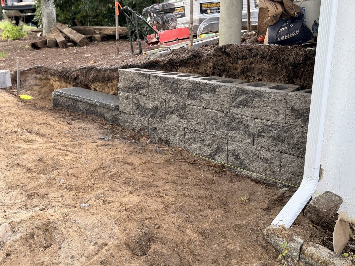 Excavated run with compacted base and the first courses set