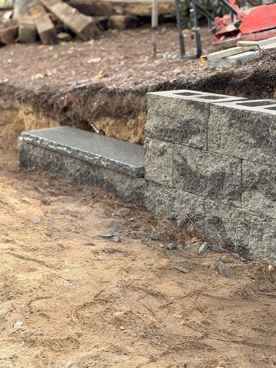 Granite tread set into the wall run