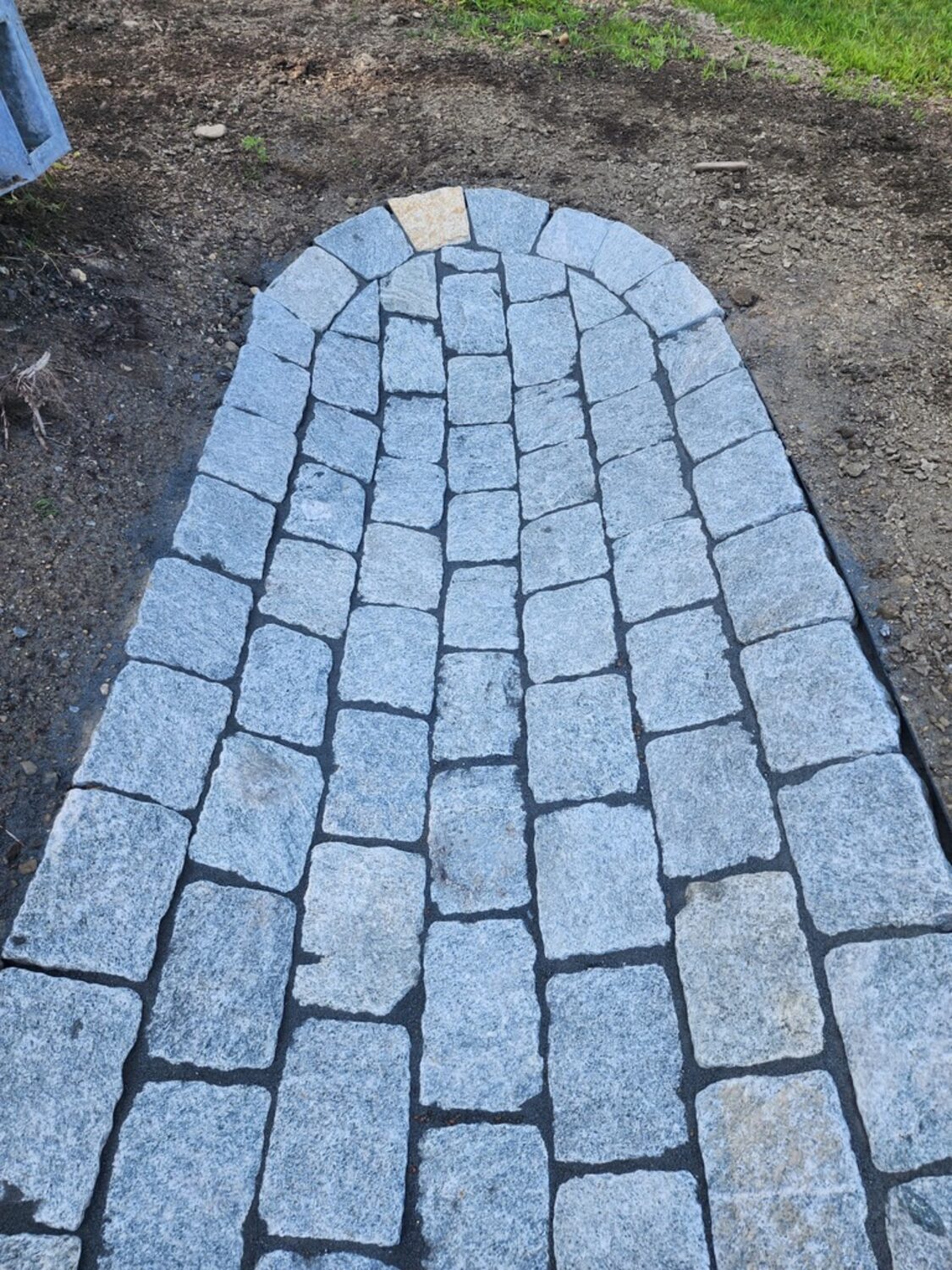 Granite cobblestone drainage apron