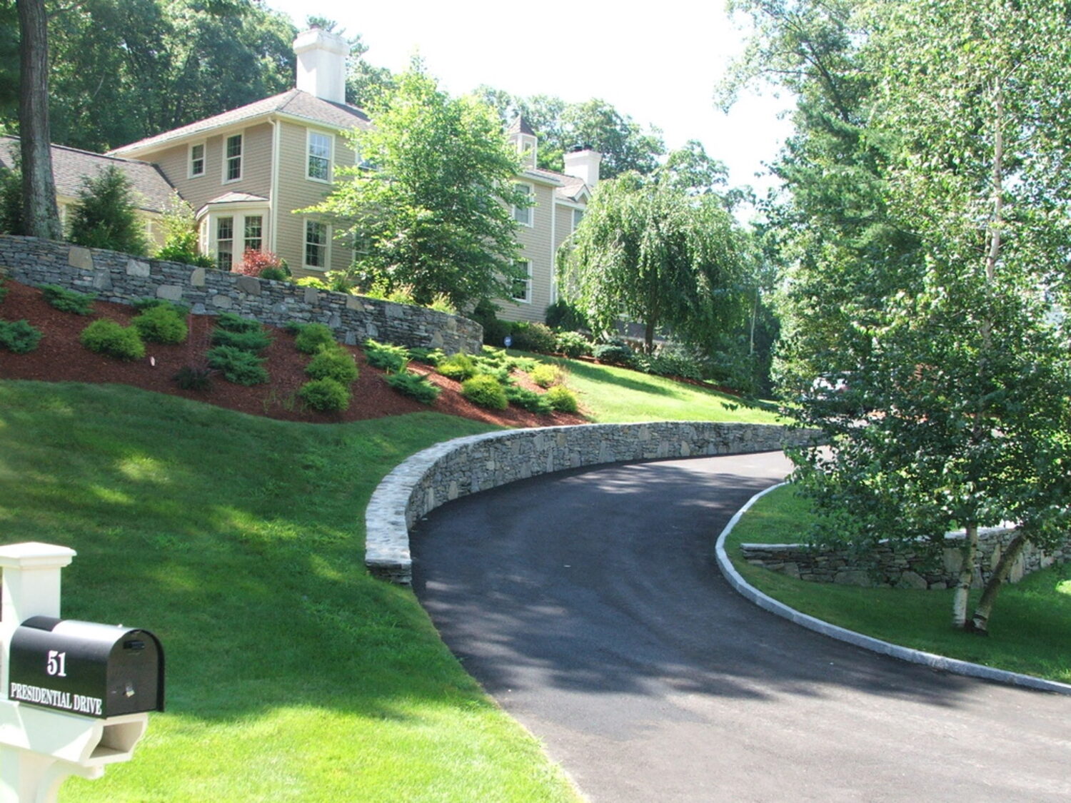 Fieldstone wall along a driveway
